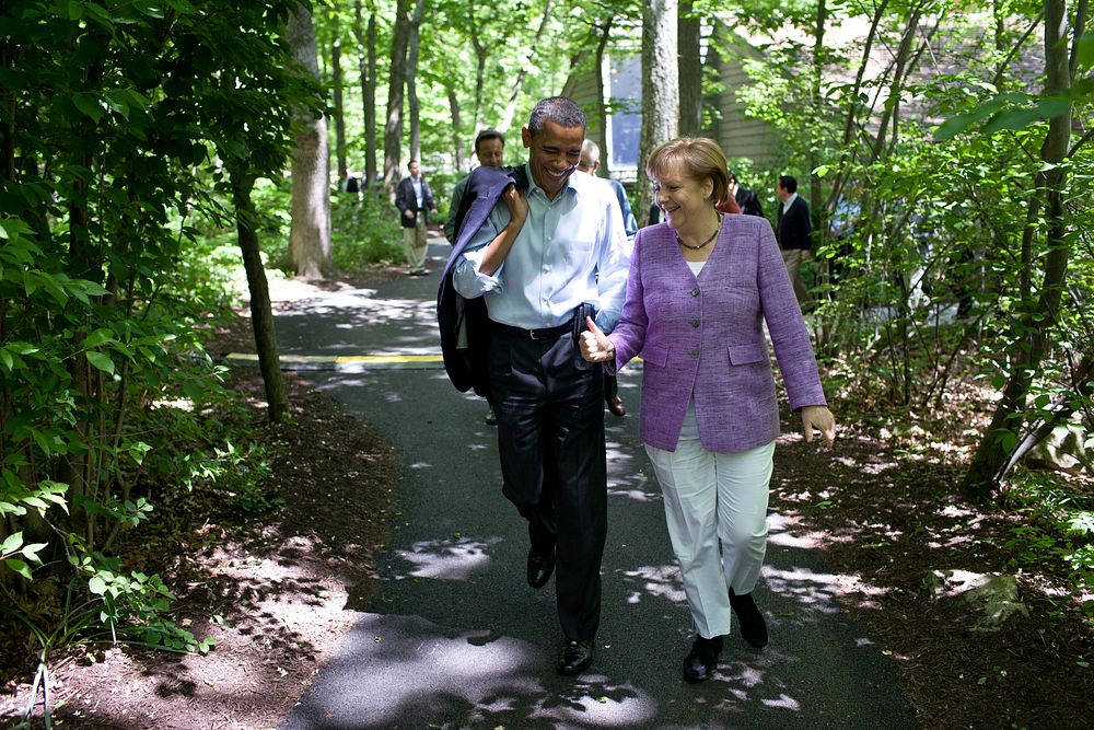 President Barack Obama talks with Chancellor Angela Merkel of Germany as they walk to Aspen Cabin during the G8 Summit at…