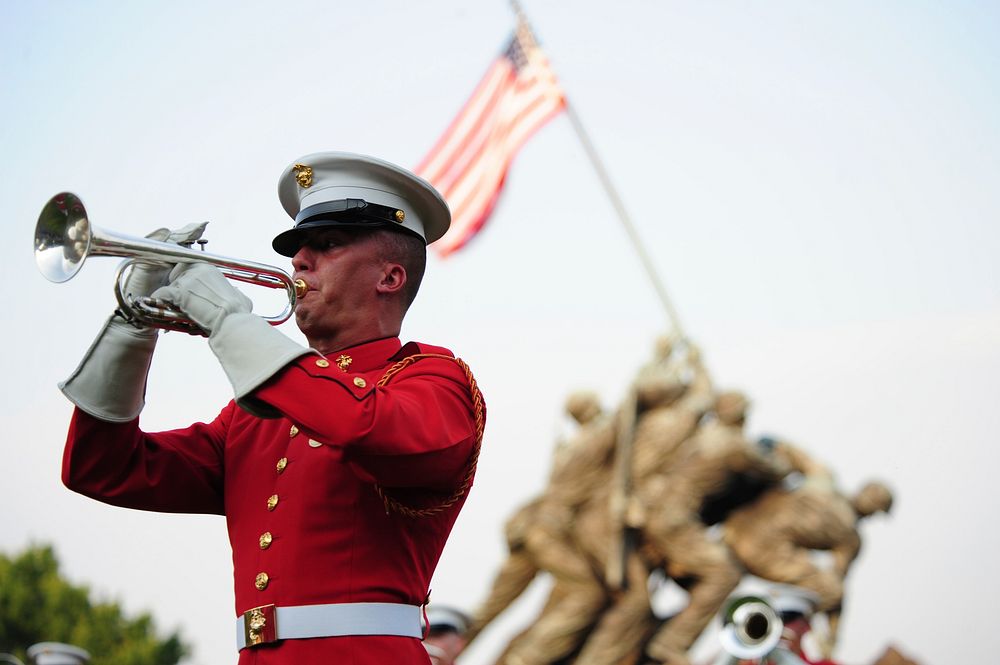 A member of the U.S. Marine Drum and Bugle Corps performs during a Sunset Parade at the Marine Corps War Memorial in…