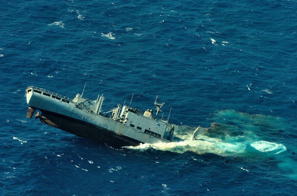 The former combat stores ships USNS Concord (T-AFS 5) sinks in the Pacific Ocean after being used as a target vessel by the…