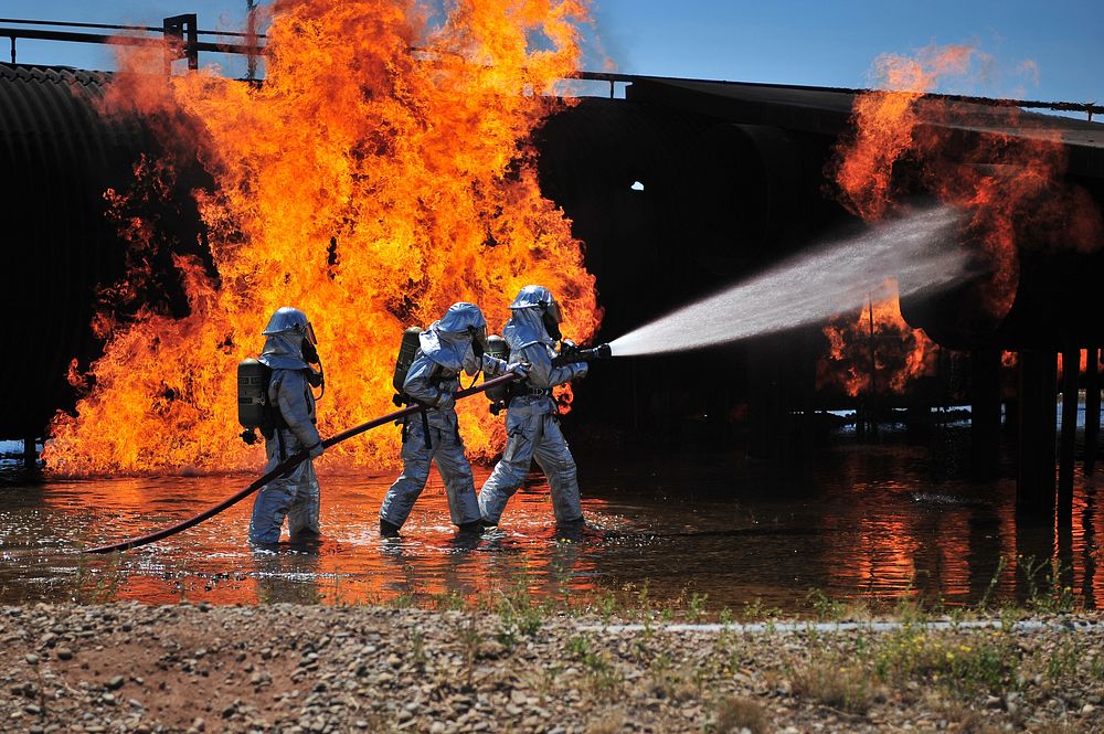 U.S. Air Force firefighters with the 27th Special Operations Civil Engineer Squadron work to extinguish a simulated engine…