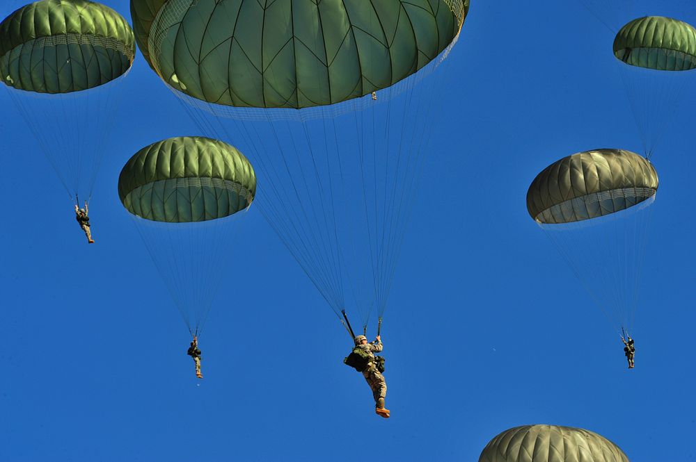 U.S. Army paratroopers with the 82nd Airborne Division participate in a personnel drop during Large Package Week (LPW)/Joint…