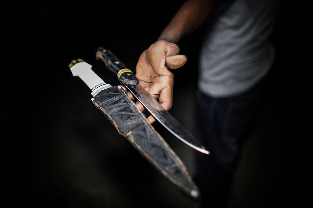 A member of the Somali Police Force (SPF) holds knives that were confiscated from civilians in the Somali capital Mogadishu.…