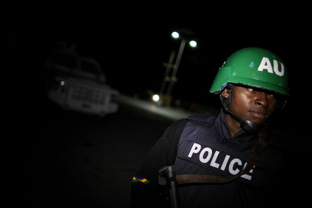 A Nigerian police officer serving with a Formed Police Unit (FPU) of the African Union Mission in Somalia (AMISOM) stands…