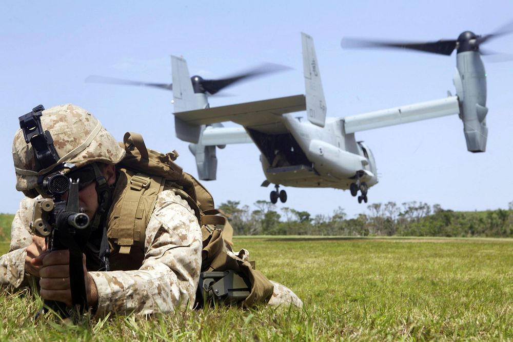 U.S. Marine Corps Lance Cpl. Andrew R. Becker provides landing zone security as an MV-22B Osprey touches down during…