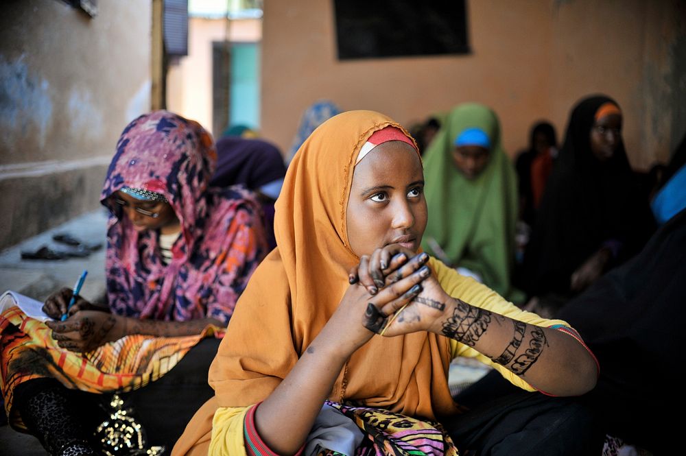 A girl at the Mother and Child Health Center in Mogadishu, Somalia, sits with other girls during a visit by the Special…