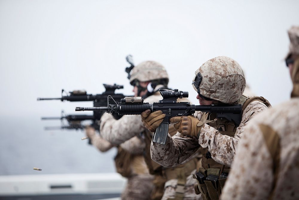 U.S. Marines assigned to Task Force Denali perform a combat marksmanship (CMP) exercise aboard the amphibious transport dock…