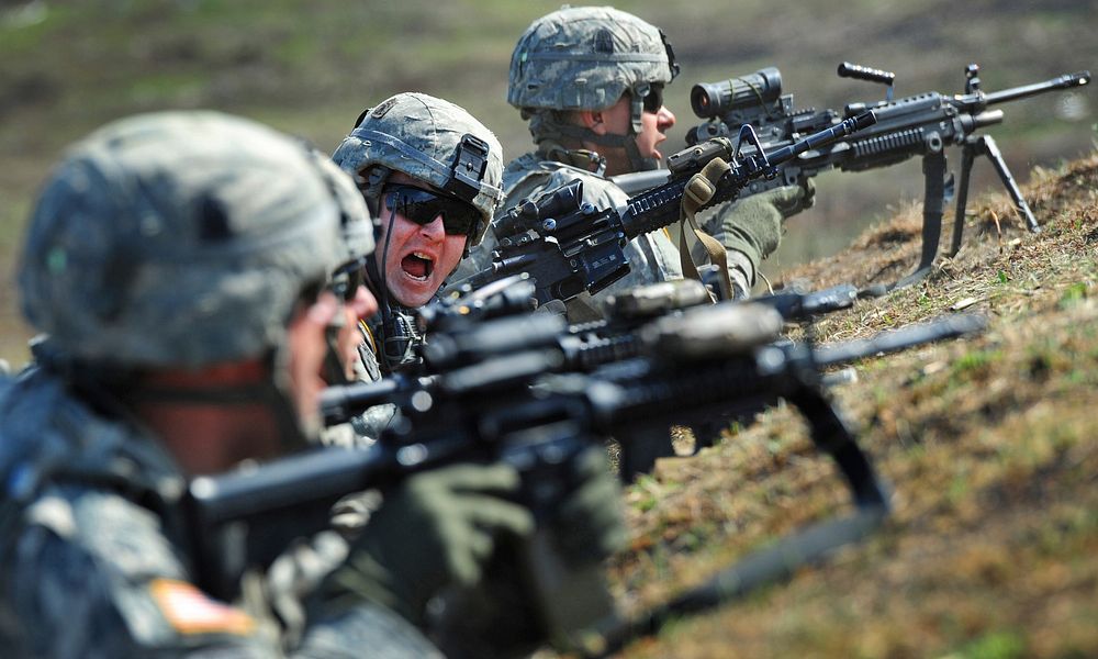 U.S> Army Cpl. Johnny Hurst, assigned to A Company 3rd Battalion (Airborne) 509th Infantry Regiment, yells a shift-fire…