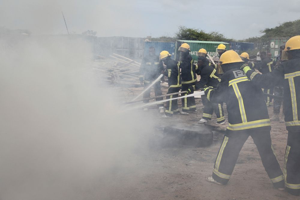 Somali firemen demonstrate their newly learned skills during an excercise attended by the Mayor of Mogadishu, Mohamed Nur…