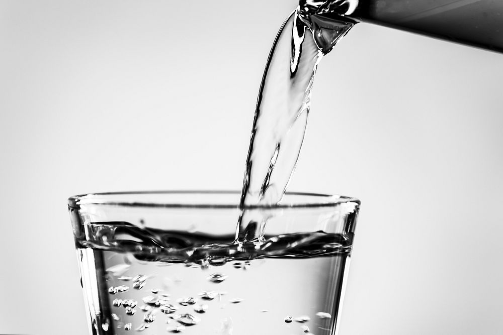 Black and white desktop wallpaper background, pouring drink to a glass