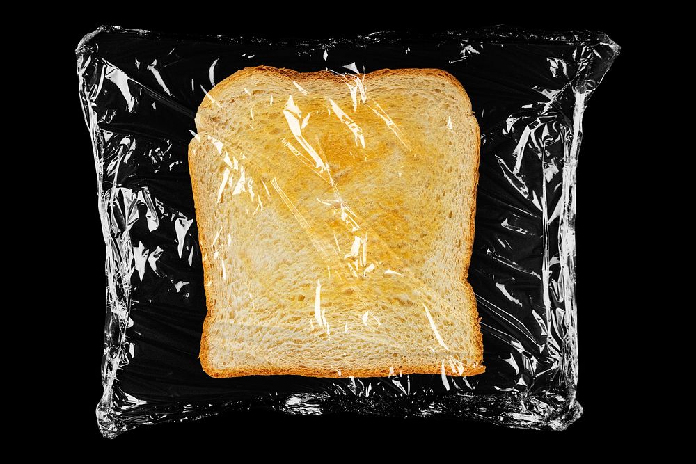 Toast in plastic, black background