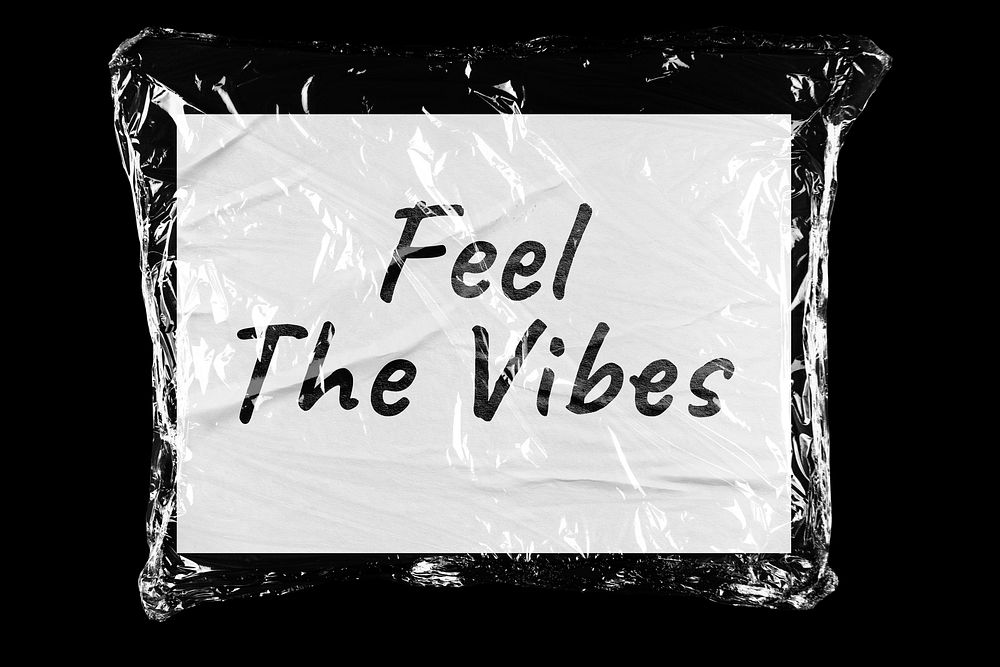 Feel the vibes plastic covered handwritten quote, black background