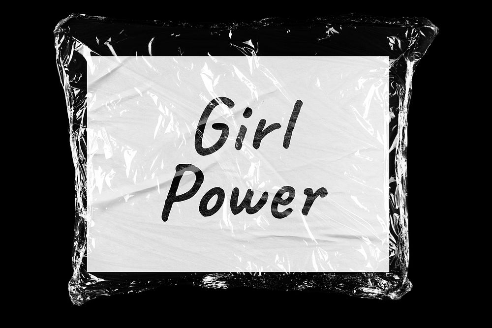 Girl power plastic covered handwritten message, black background