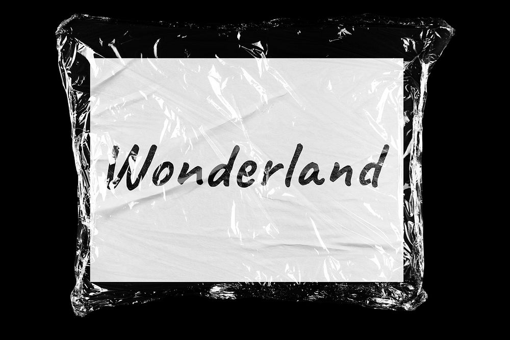 Wonderland plastic covered handwritten message, black background