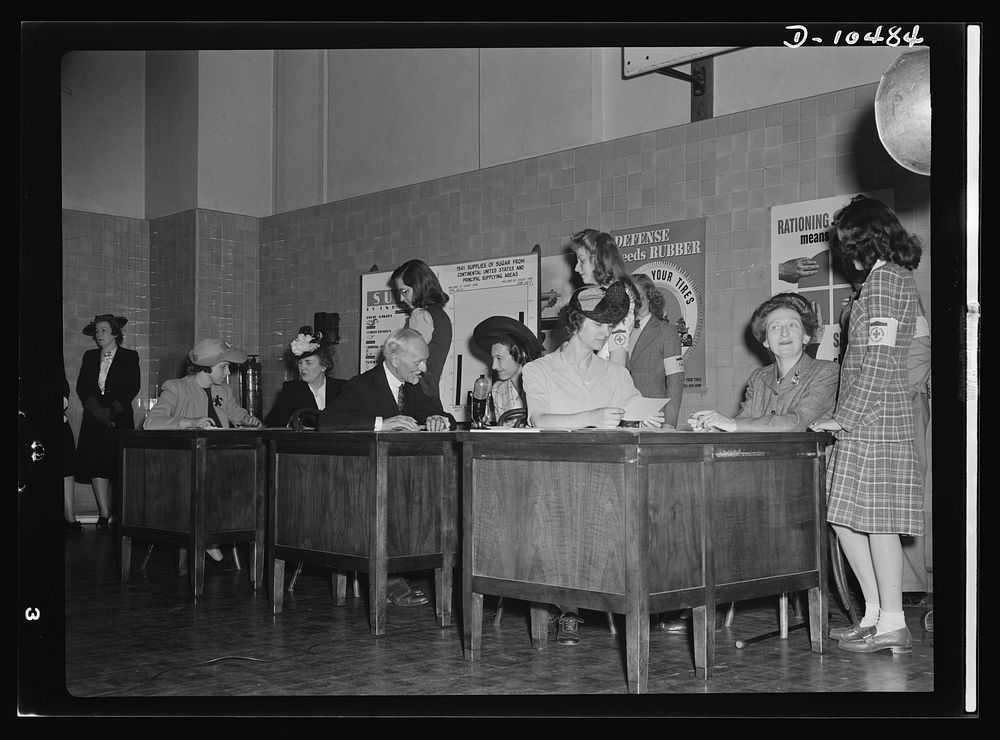 Sugar rationing. Three prominent ladies learn how to register for their sugar rationing books. Mrs. Henry Wallace, Mrs. Leon…