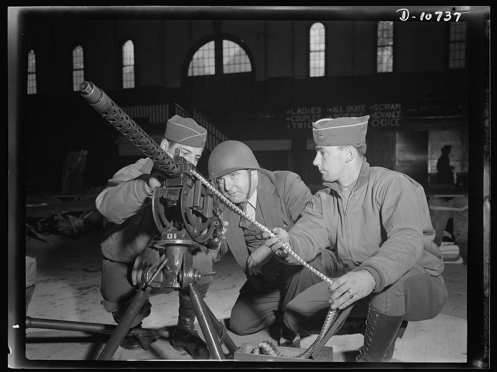 War production drive. Anthracite rallies. Soldiers taught a coal miner how to operate a machine gun at an anthracite rally…