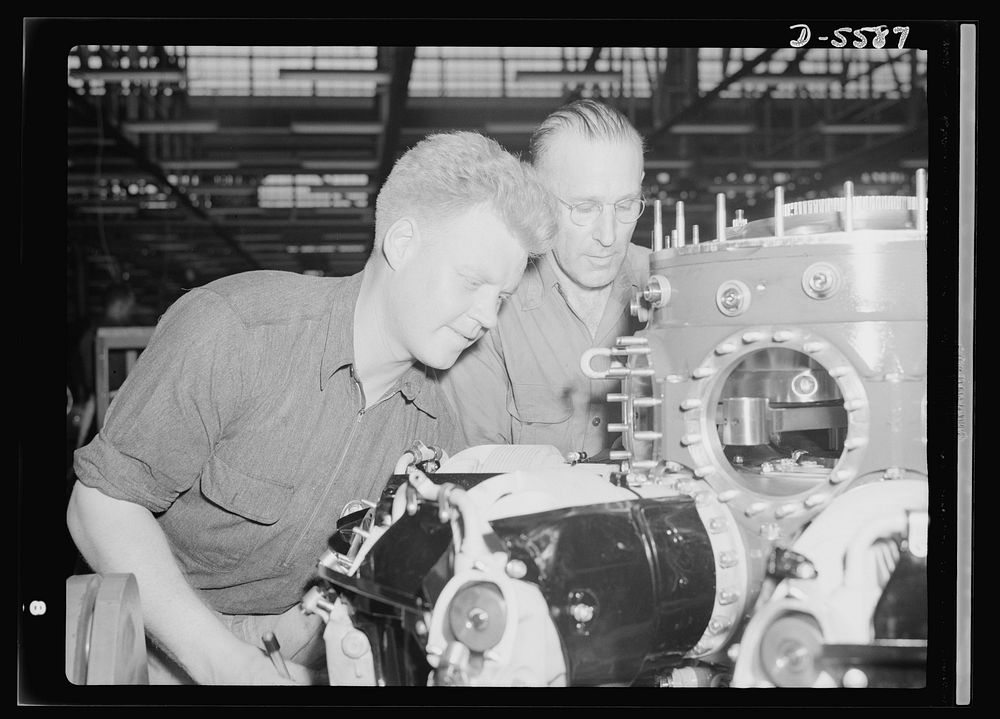 Production. Aircraft engines. Two of the nation's millions of war workers attach cylinder barrels to one of the "green"…
