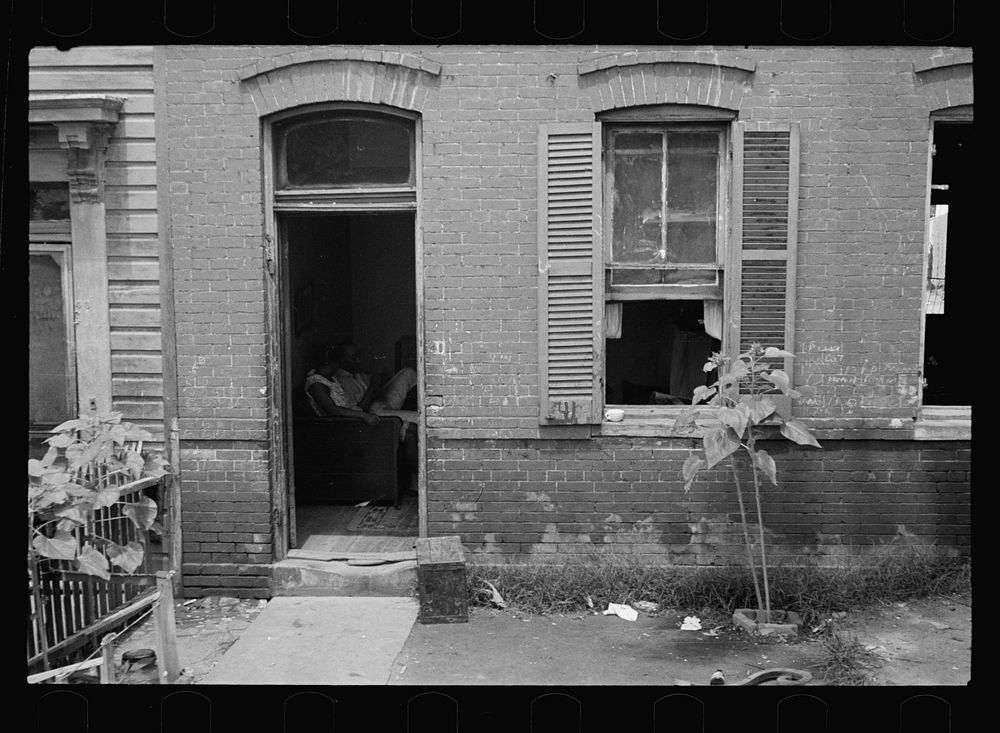 Front home near Capitol, Washington, D.C. Interiors of these homes vary little. A chair or two and a table, a bed and…