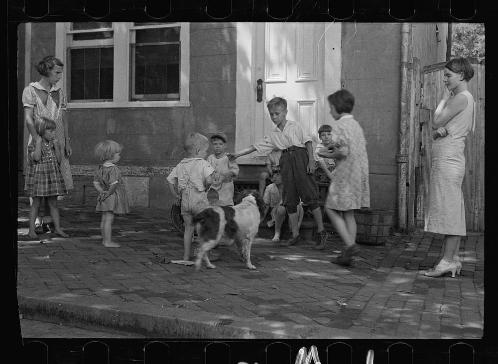 Poor children playing on sidewalk, Georgetown, Washington, D.C.. Sourced from the Library of Congress.