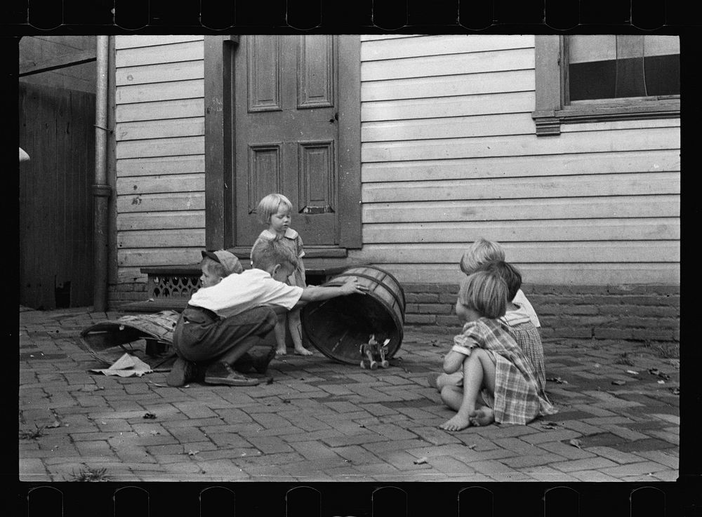 [Untitled photo, possibly related to: Poor children playing on sidewalk, Georgetown, Washington, D.C.]. Sourced from the…