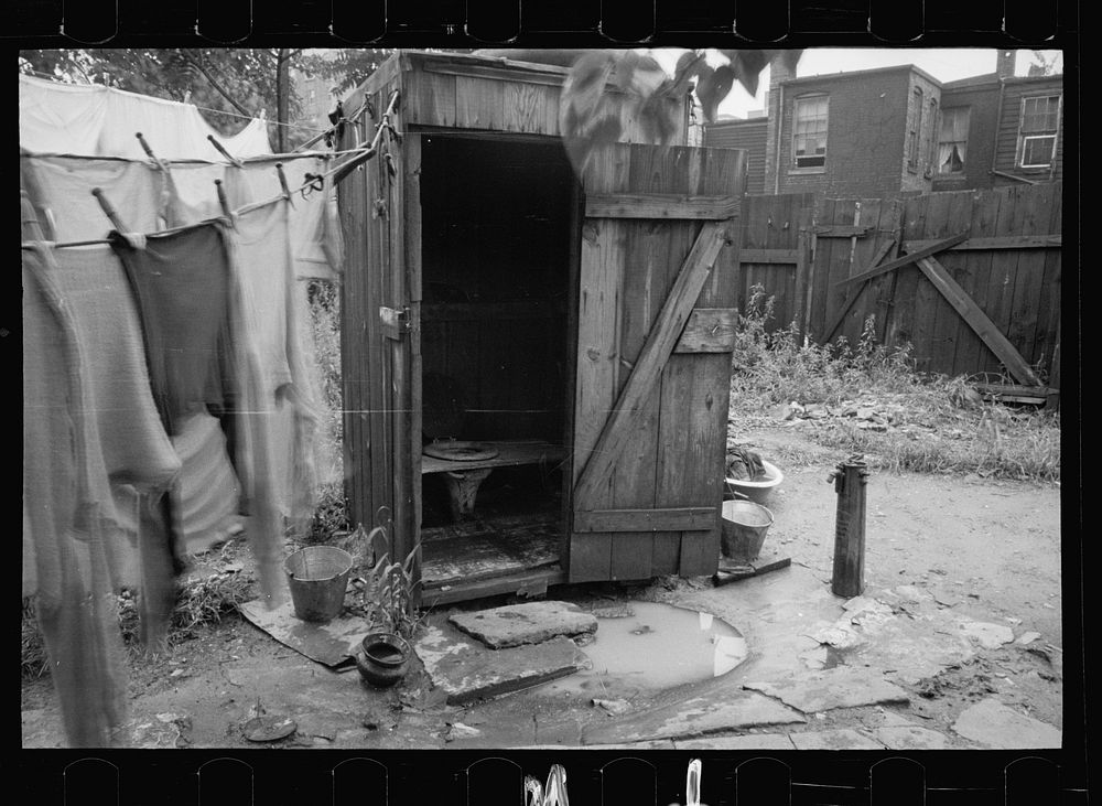 [Untitled photo, possibly related to: Backyard and privy near Government Printing Office, Washington, D.C. The pump on the…