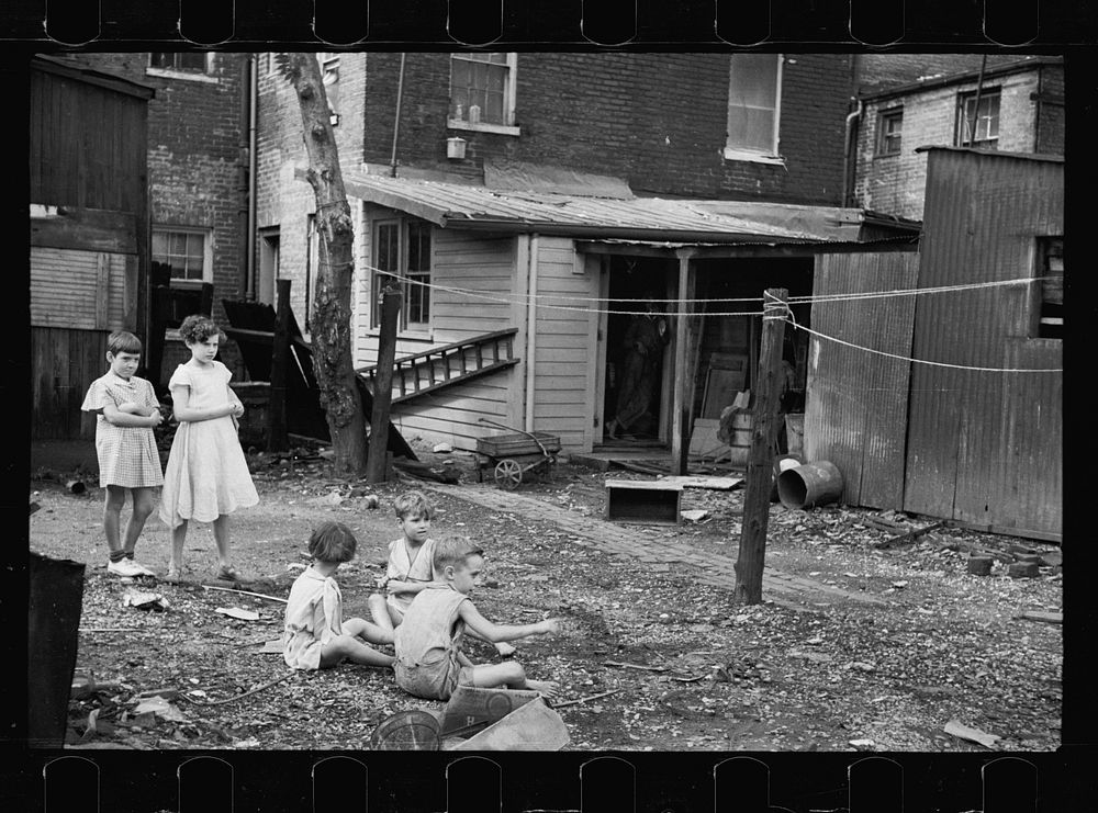 [Untitled photo, possibly related to: Slum children at play, Washington, D.C. Children in their backyard near the Capitol.…