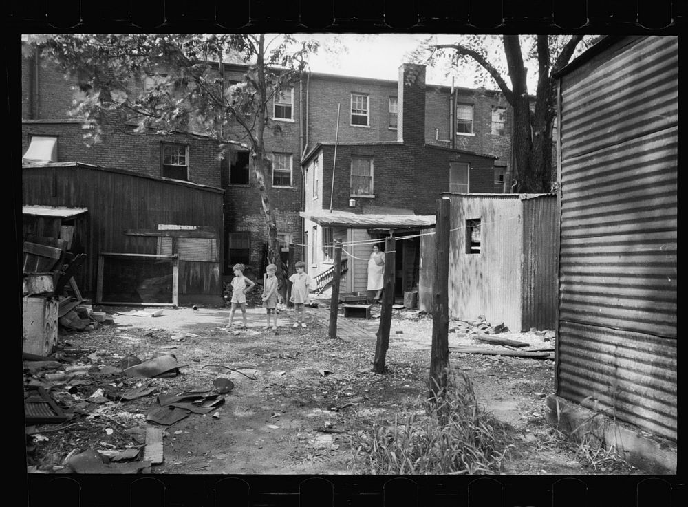 [Untitled photo, possibly related to: Children in slum area, Washington, D.C. Children in their backyard in a slum area near…