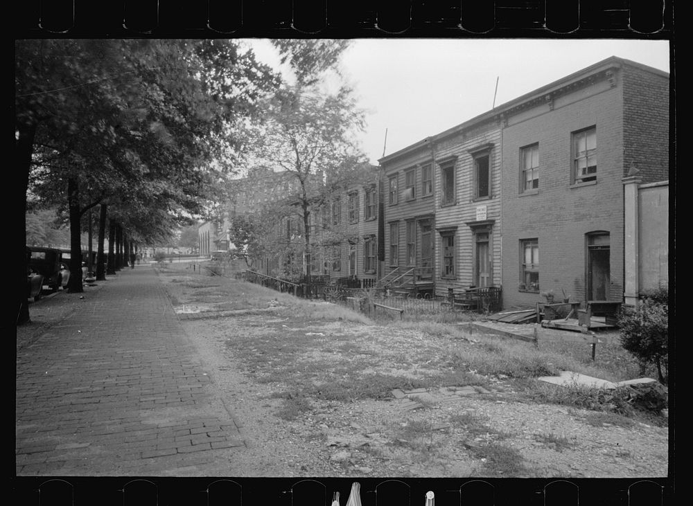Section of Massachusetts Avenue showing block of shabby houses with outside toilets and water supply, Washington, D.C..…