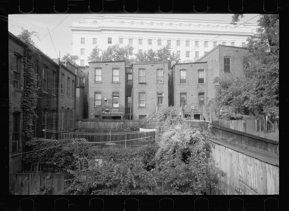 Slum area near House office building, Washington, D.C. Many of these houses have outside toilets. Sourced from the Library…
