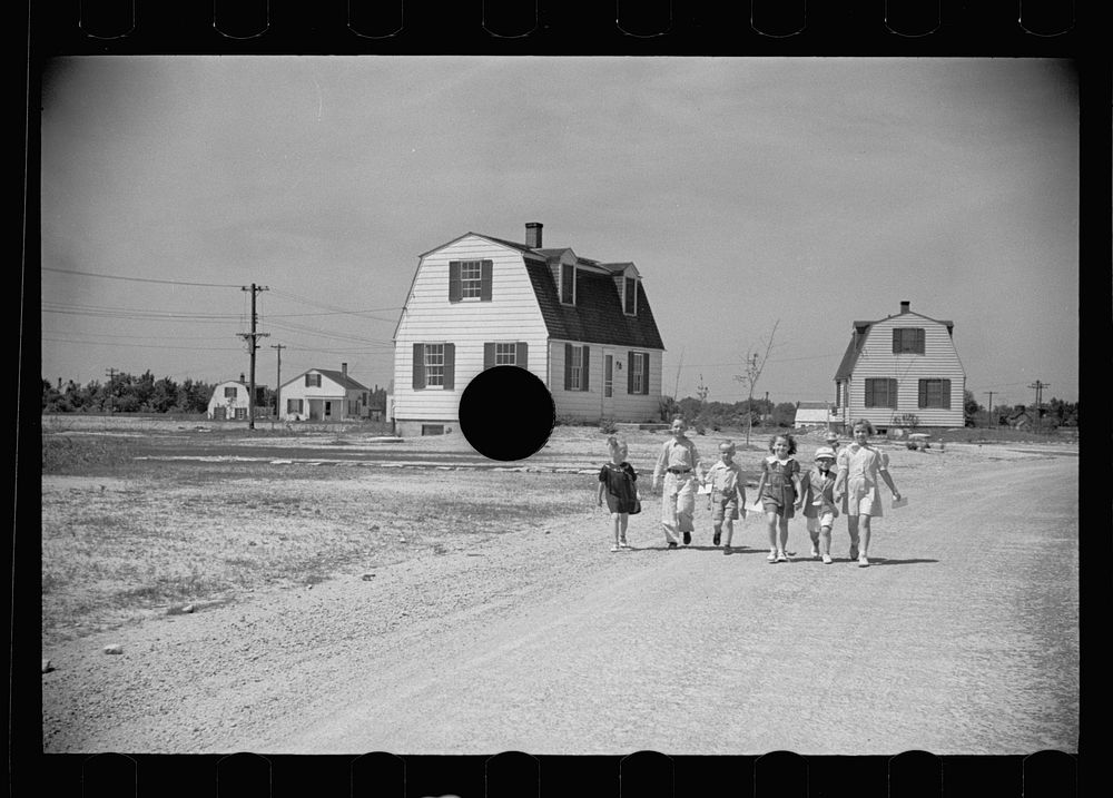 [Untitled photo, possibly related to: Homestead children coming home from school, Decatur Homesteads, Indiana]. Sourced from…
