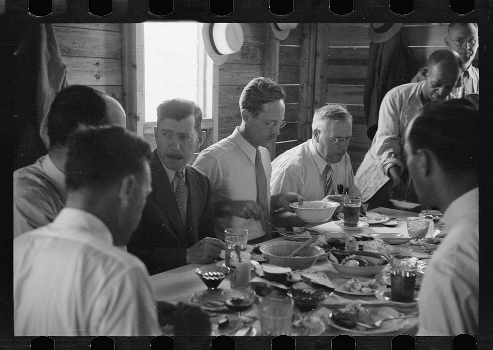 Resettlement officials eating in the mess hall at Greenbelt, Maryland. Sourced from the Library of Congress.