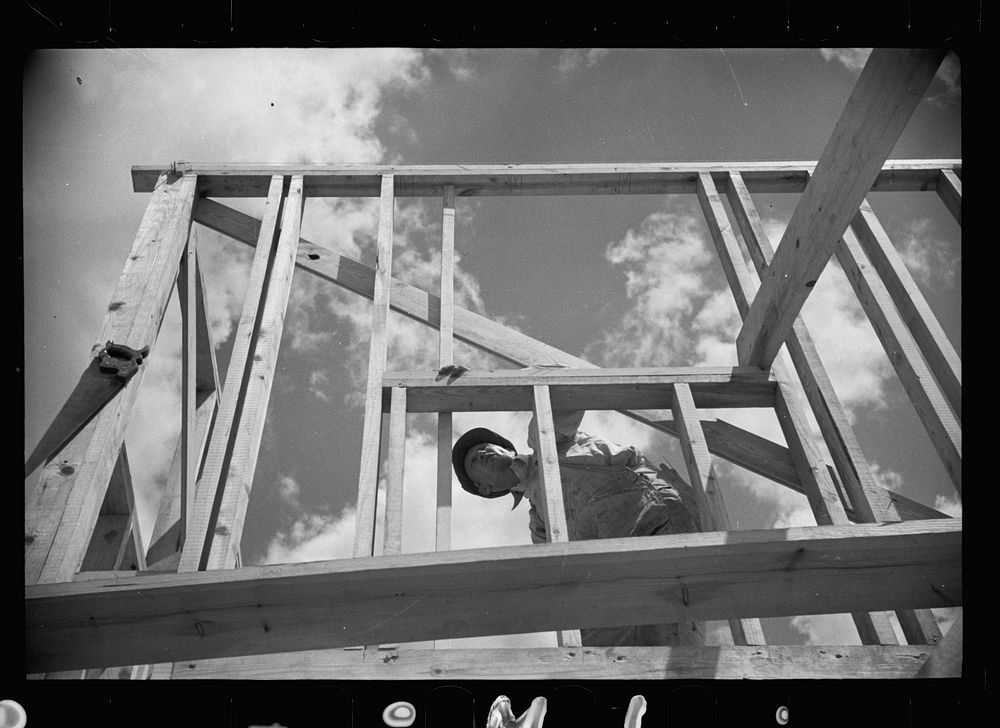 Carpenter at work, Greenbelt, Maryland. Sourced from the Library of Congress.