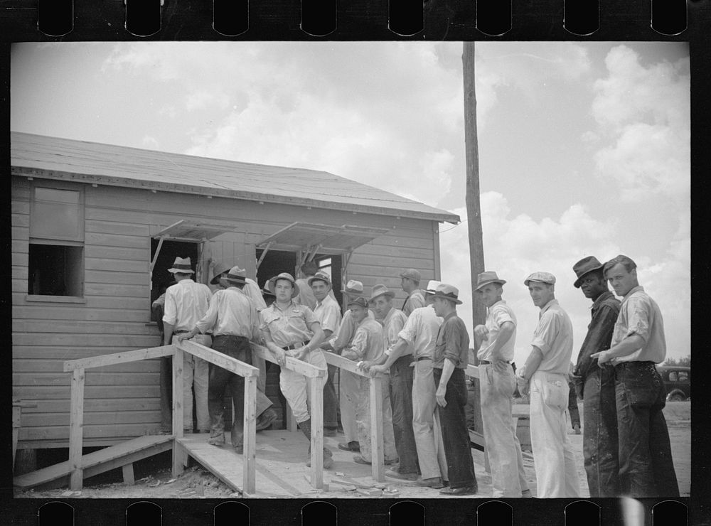 Workmen receiving paychecks, Greenbelt, Maryland. Sourced from the Library of Congress.