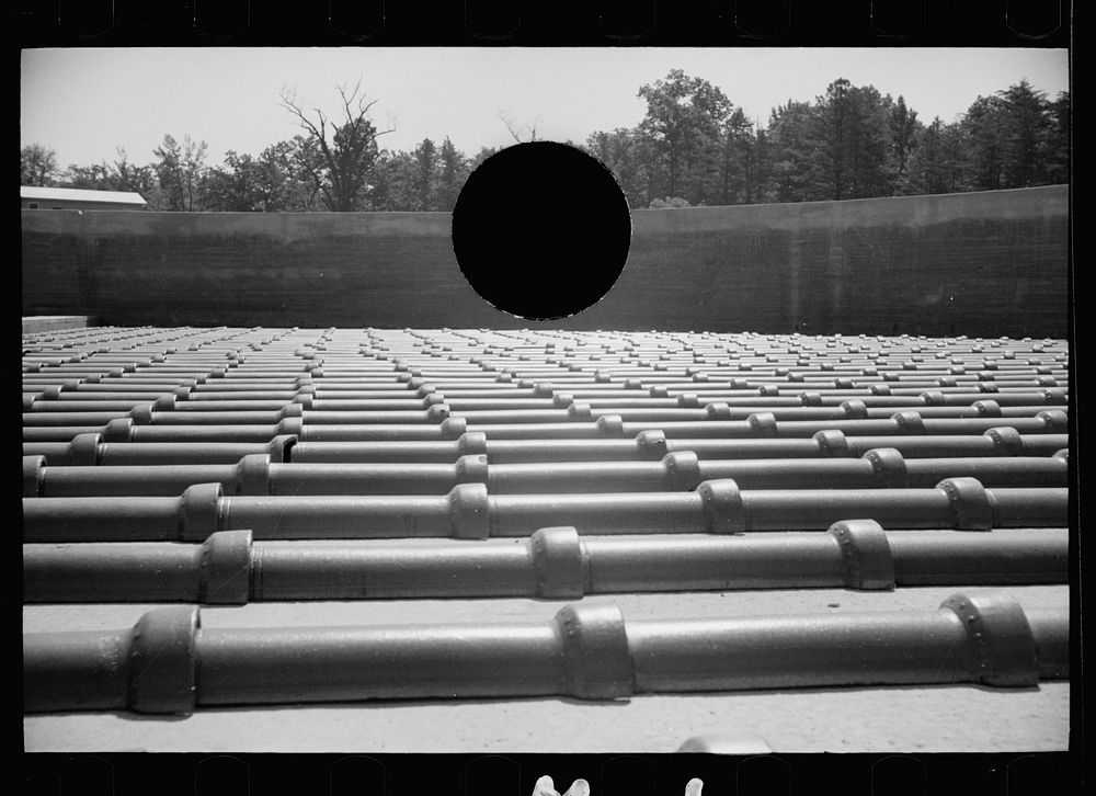 [Untitled photo, possibly related to: Tile sewer pipe to be used at Greenbelt, Maryland]. Sourced from the Library of…
