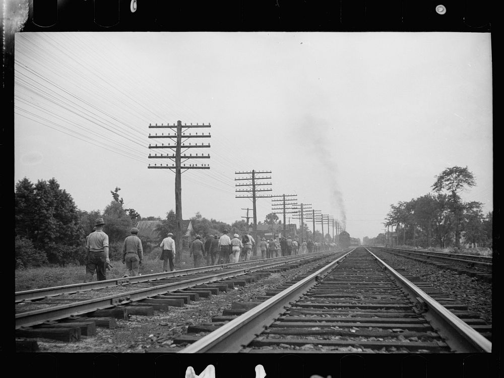 Men leaving work at Greenbelt, Maryland. Sourced from the Library of Congress.