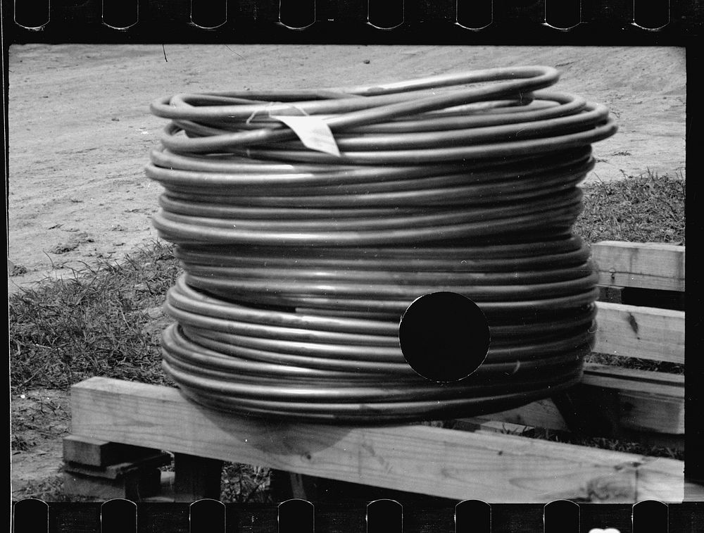 [Untitled photo, possibly related to: Lead pipe, plumbing fixture storage in background, Greenbelt, Maryland]. Sourced from…