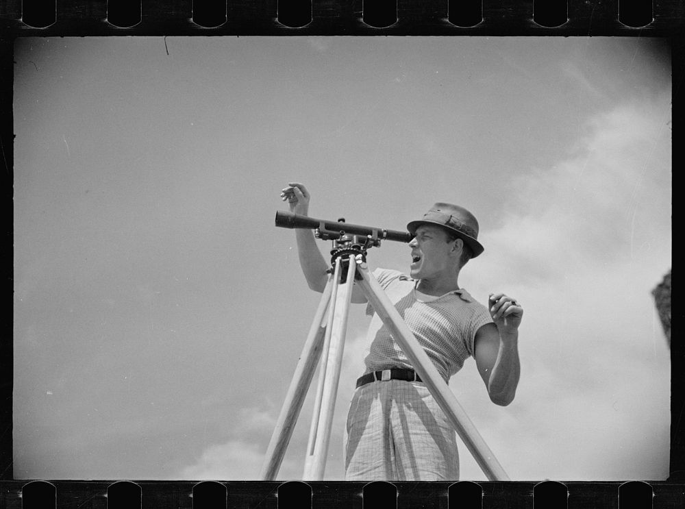 [Untitled photo, possibly related to: Surveyor working in a model community planned by the Suburban Division of the United…