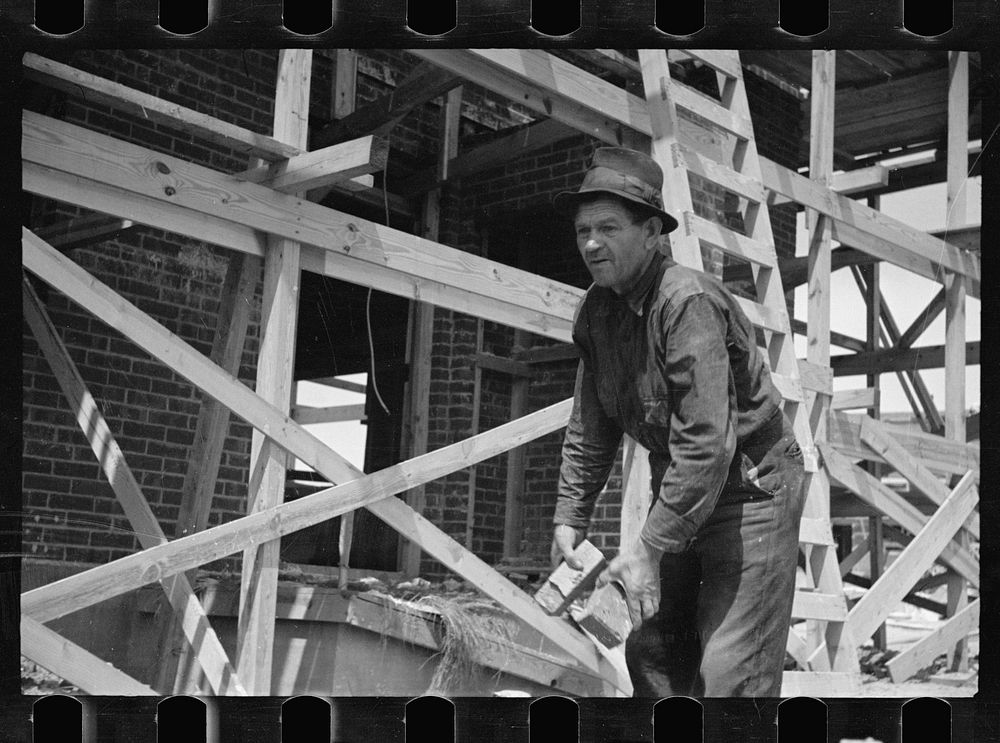 [Untitled photo, possibly related to: Carpenter at Greenbelt, Maryland]. Sourced from the Library of Congress.