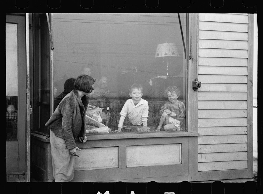 Children in window of their home which was formerly a store, Hamilton Road, Franklin Township, Bound Brook, New Jersey.…