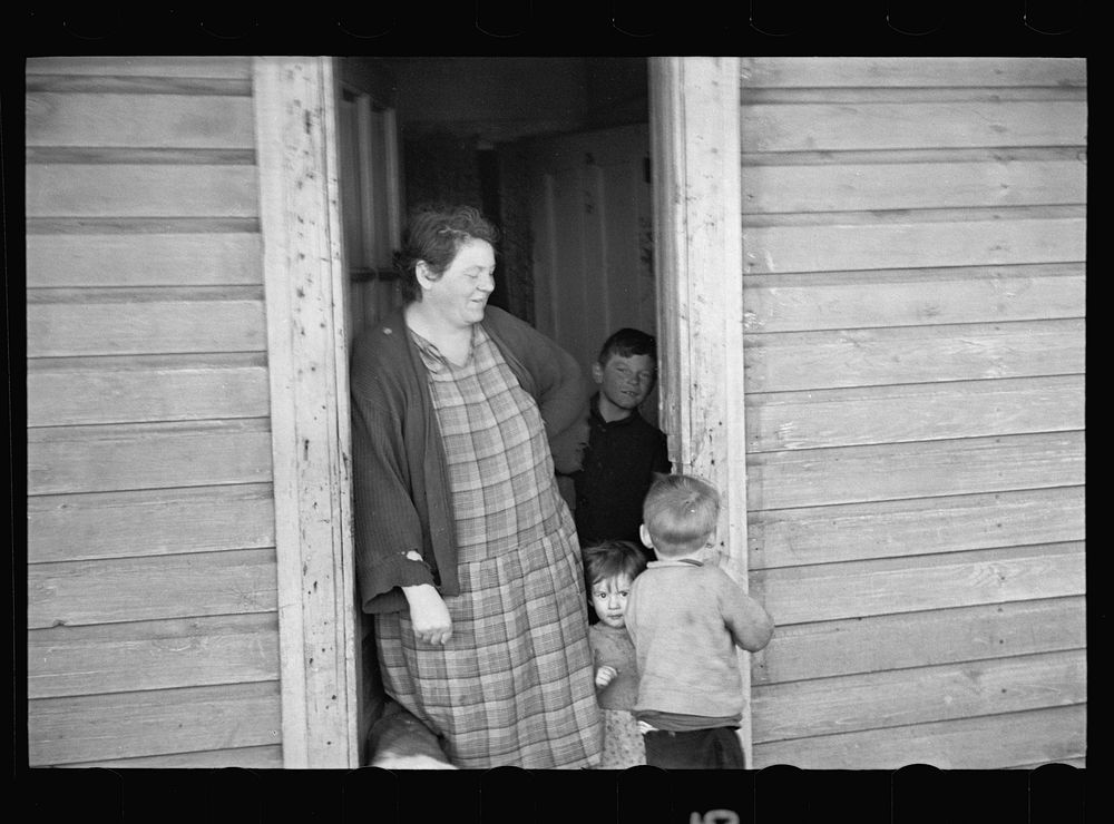 Women and children at farm off Hamilton Road, Franklin Township, Bound Brook, New Jersey. Sourced from the Library of…