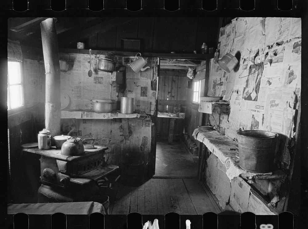 [Untitled photo, possibly related to: Kitchen and washroom of two room mountain shack, Route U.S. 11, a few miles east of…