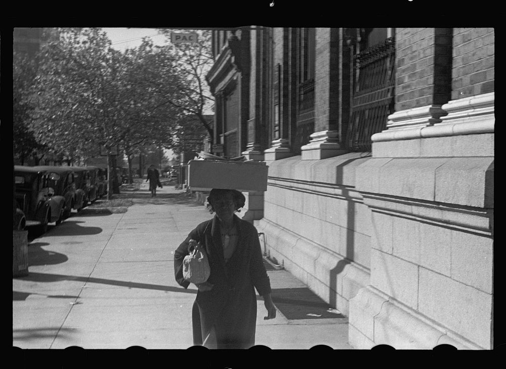  woman carrying groceries, Newport News, Virginia. Sourced from the Library of Congress.