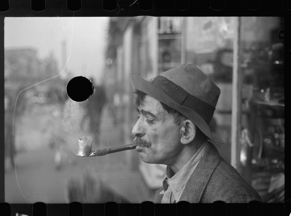 [Untitled photo, possibly related to: Man with homemade pipe, Washington, D.C.]. Sourced from the Library of Congress.