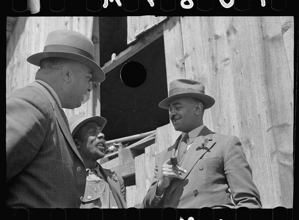 [Untitled photo, possibly related to: Nat Williamson with   county agent and vocational director. Williamson has received a…