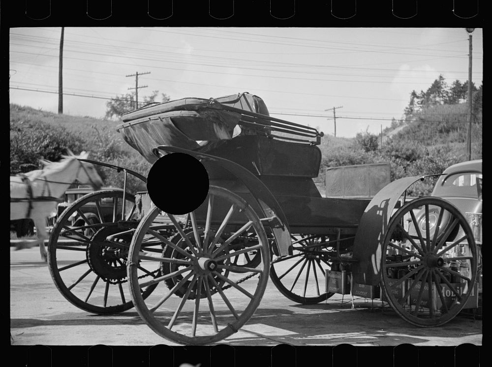 [Untitled photo, possibly related to: Old horseless carriage at gasoline station near Lost River, New Hampshire]. Sourced…