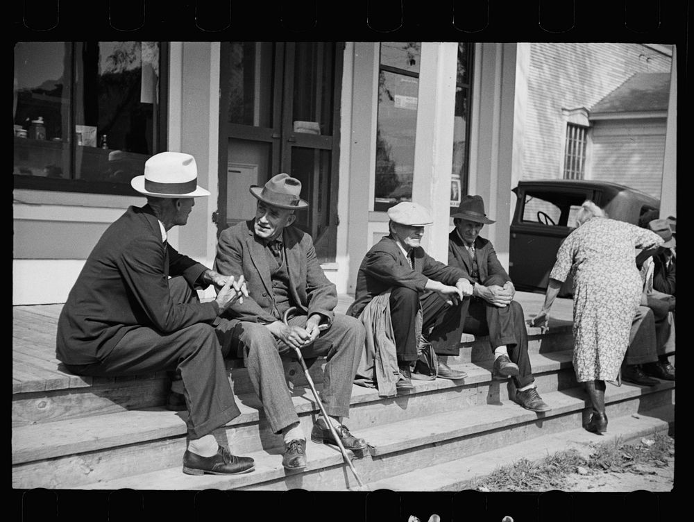 [Untitled photo, possibly related to: Fair at Albany, Vermont. The old timers take to the steps of the general store].…