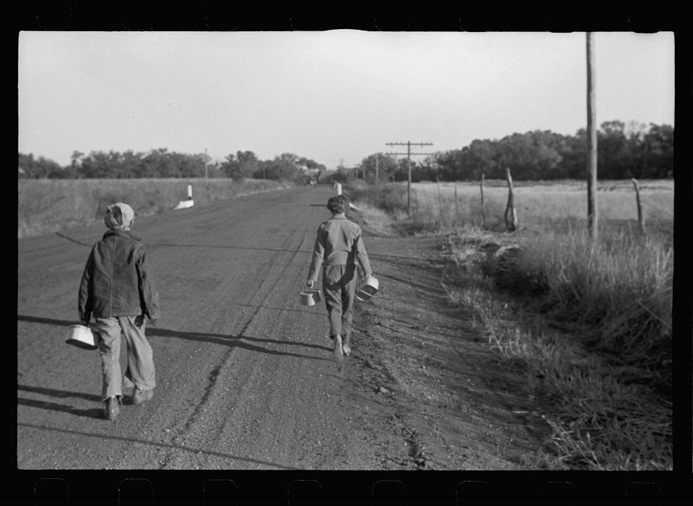 [Untitled photo, possibly related to: Farm children on the way to school with lunch pails, Nebraska]. Sourced from the…