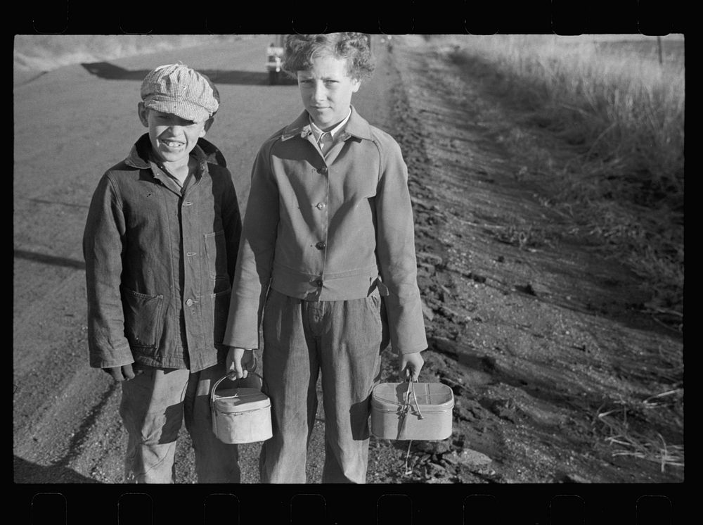 Farm children on the way to school with lunch pails, Nebraska. Sourced from the Library of Congress.