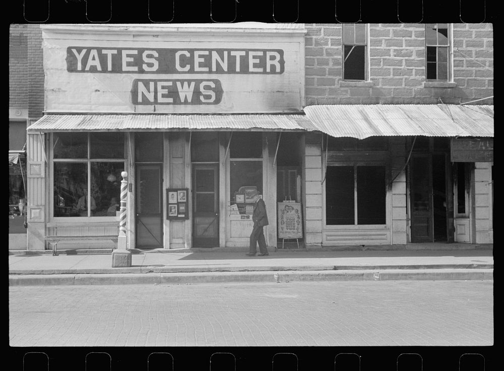 Barber shop, newspaper office, and photographer's studio. Yates Center, Kansas. Sourced from the Library of Congress.