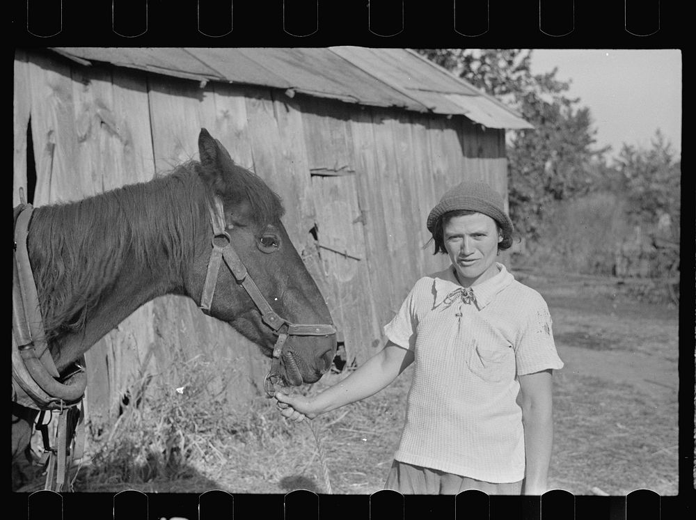 Girl who operates large farm with help of her sister and a rehabilitation loan, Coffey County, Kansas. Sourced from the…