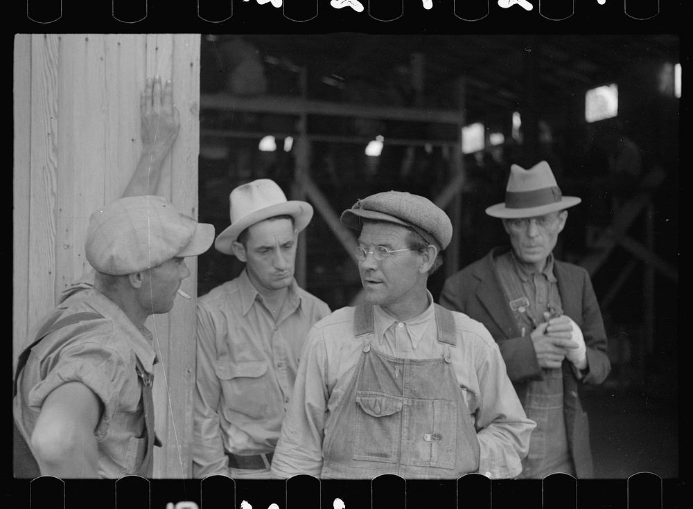 [Untitled photo, possibly related to: Farmers waiting for the auction to begin. Oskaloosa, Kansas]. Sourced from the Library…